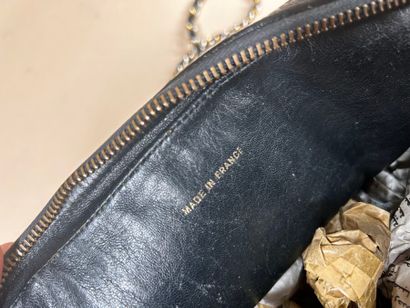 CHANEL 
Black ostrich leather 