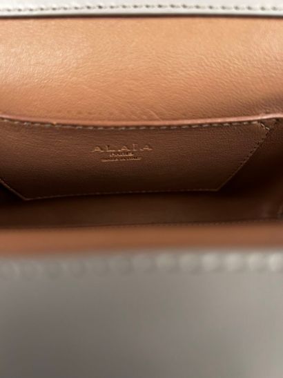ALAIA Paris 
Small light gray leather handbag,...