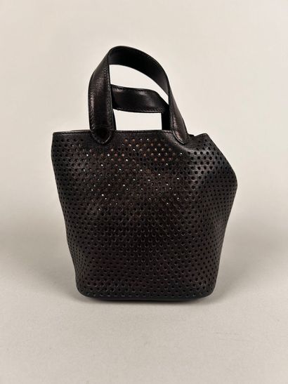 ALAIA Paris 
Mini handbag in perforated black...