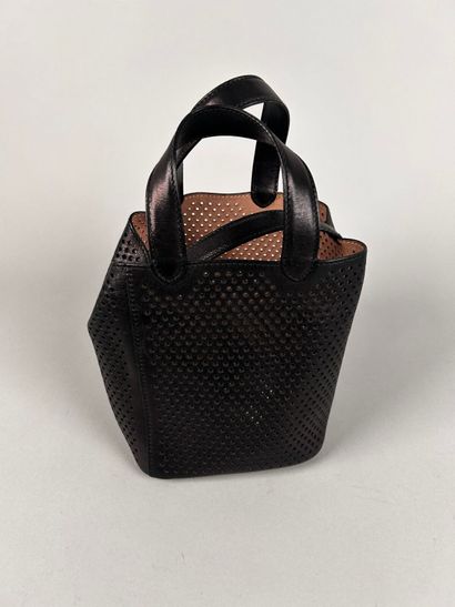 ALAIA Paris 
Mini handbag in perforated black...