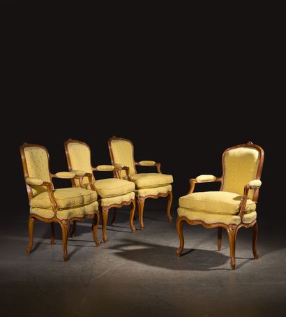A set of four cabriolet armchairs in natural...
