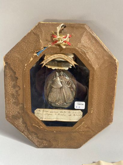 Gilded wood-framed octagonal reliquary containing...