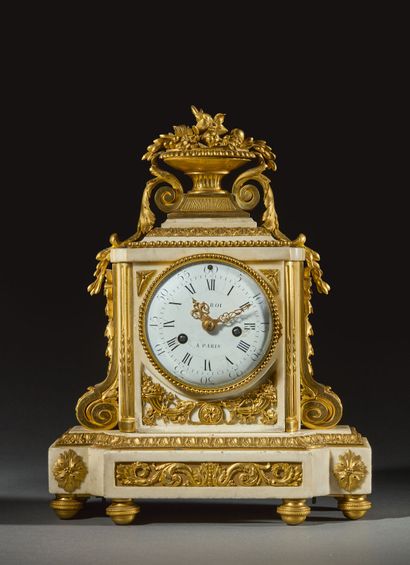 A white marble and gilded chiseled bronze...