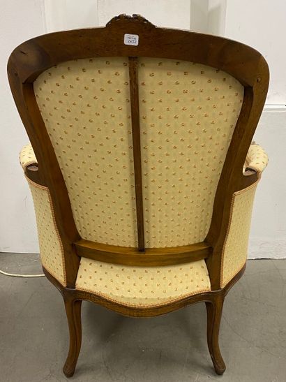 Pair of bergères in natural wood, molded...