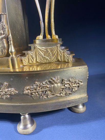 Gilt bronze and chased terminal clock decorated...