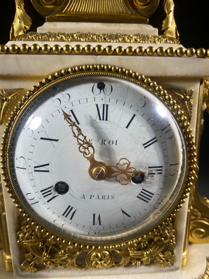 A white marble and gilded chiseled bronze...