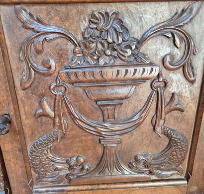 Carved walnut cabinet opening to five drawers...