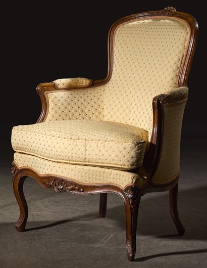 Pair of bergères in natural wood, molded...