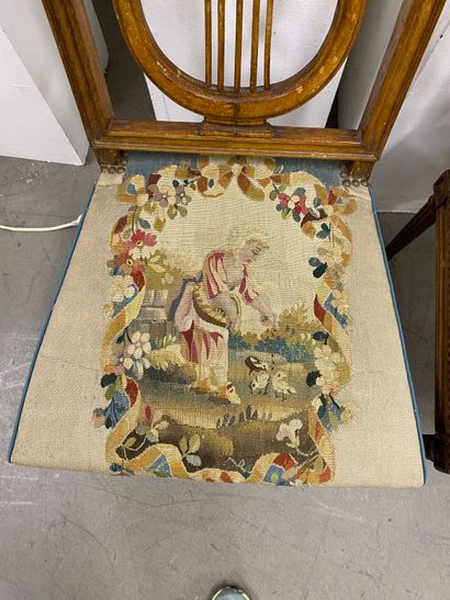 Four molded beech chairs with lyre-shaped...