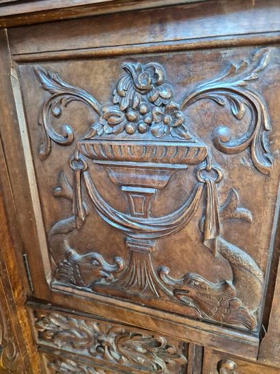 Carved walnut cabinet opening to five drawers...