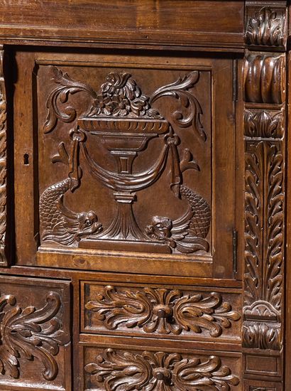 Carved walnut cabinet opening to five drawers...