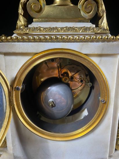 A white marble and gilded chiseled bronze...