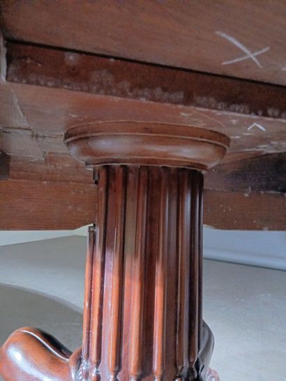 Large circular mahogany dining table, the...