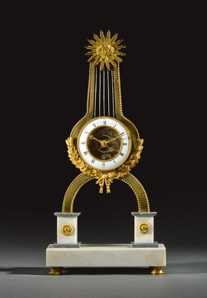 Skeleton lyre clock in gilded bronze and...