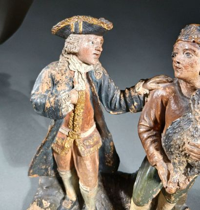 Polychrome terra cotta group depicting a...