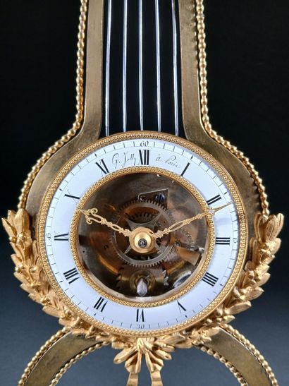 Skeleton lyre clock in gilded bronze and...