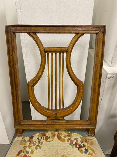 Four molded beech chairs with lyre-shaped...