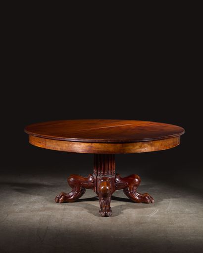 Large circular mahogany dining table, the...