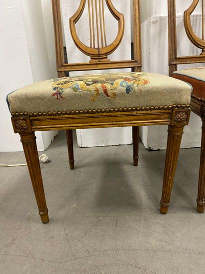 Four molded beech chairs with lyre-shaped...