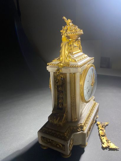A white marble and gilded chiseled bronze...