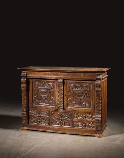 Carved walnut cabinet opening to five drawers...