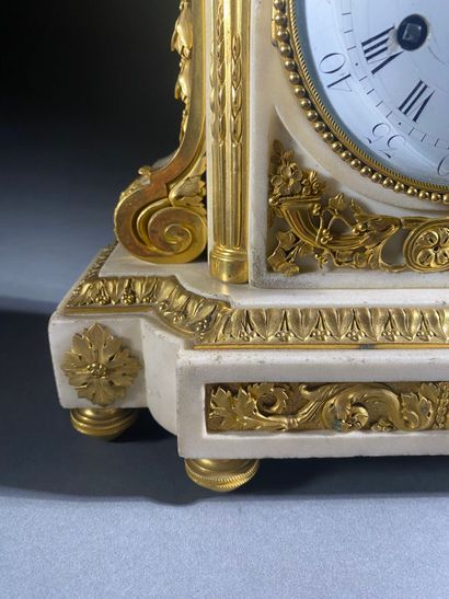 A white marble and gilded chiseled bronze...