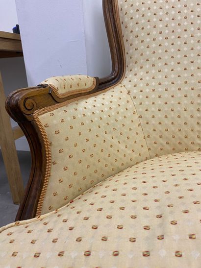 Pair of bergères in natural wood, molded...