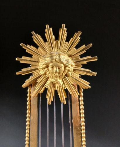 Skeleton lyre clock in gilded bronze and...