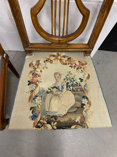 Four molded beech chairs with lyre-shaped...