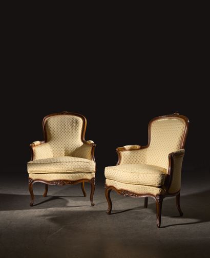 Pair of bergères in natural wood, molded...