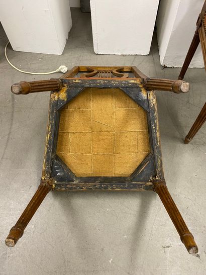 Four molded beech chairs with lyre-shaped...