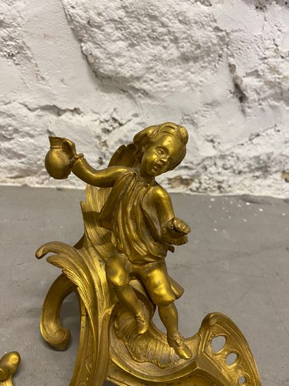 Pair of gilded bronze andirons, chiseled...