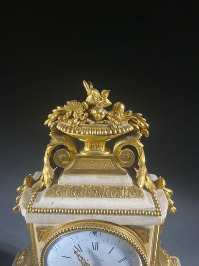 A white marble and gilded chiseled bronze...