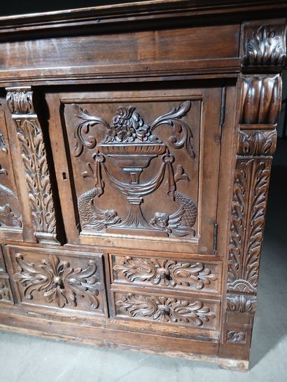 Carved walnut cabinet opening to five drawers...