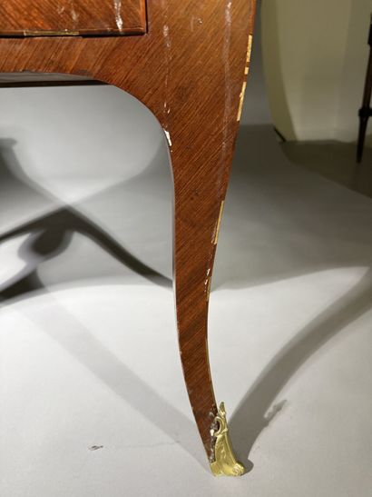 A rosewood and palisander chest of drawers...