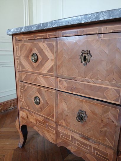 Center-recessed veneered wood chest of drawers...