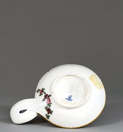 SÈVRES
Soft-paste porcelain hand-held candlestick...