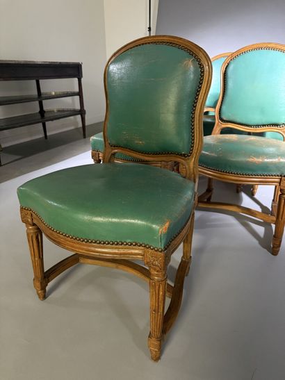Ten chairs in molded beech with rounded backs,...