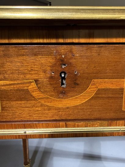 A small, flat desk made of rosewood and amaranth,...