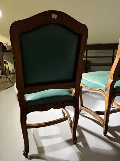 Four chairs in molded and carved beech, with...
