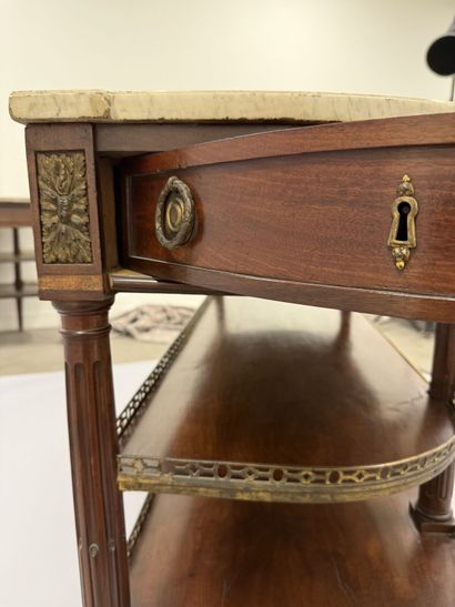 A pair of half-moon-shaped mahogany console...