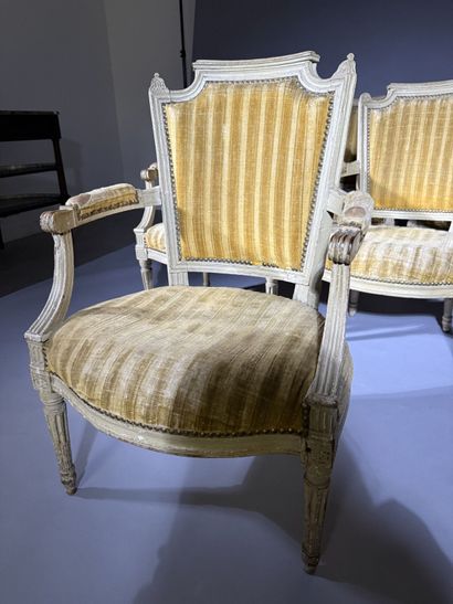 A set of six armchairs and one sofa, made...