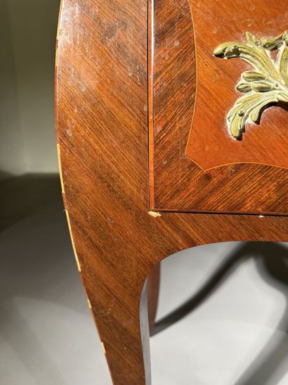 A rosewood and palisander chest of drawers...