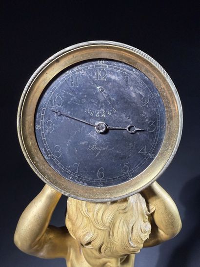 Pendule en bronze doré à cadran double (à...