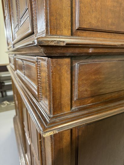 Two-section walnut cabinet with four-panel...