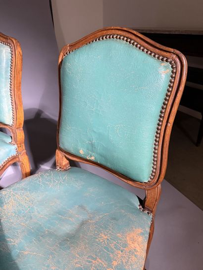 Four chairs in molded and carved beech, with...