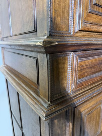 Two-section walnut cabinet with four-panel...