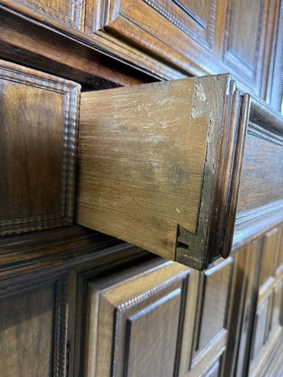 Two-section walnut cabinet with four-panel...