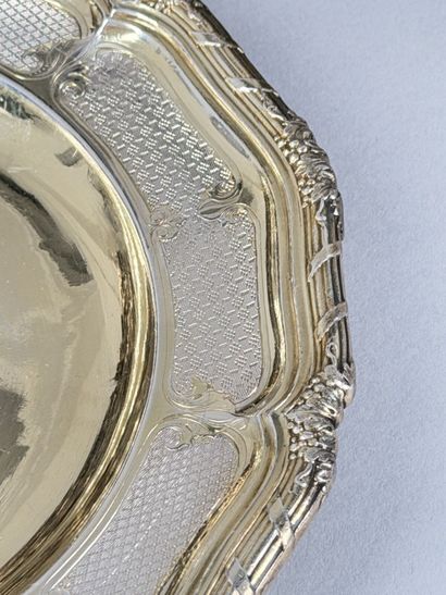 Set of twenty-four multi-lobed vermeil plates...