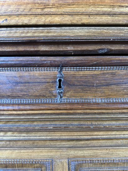Two-section walnut cabinet with four-panel...